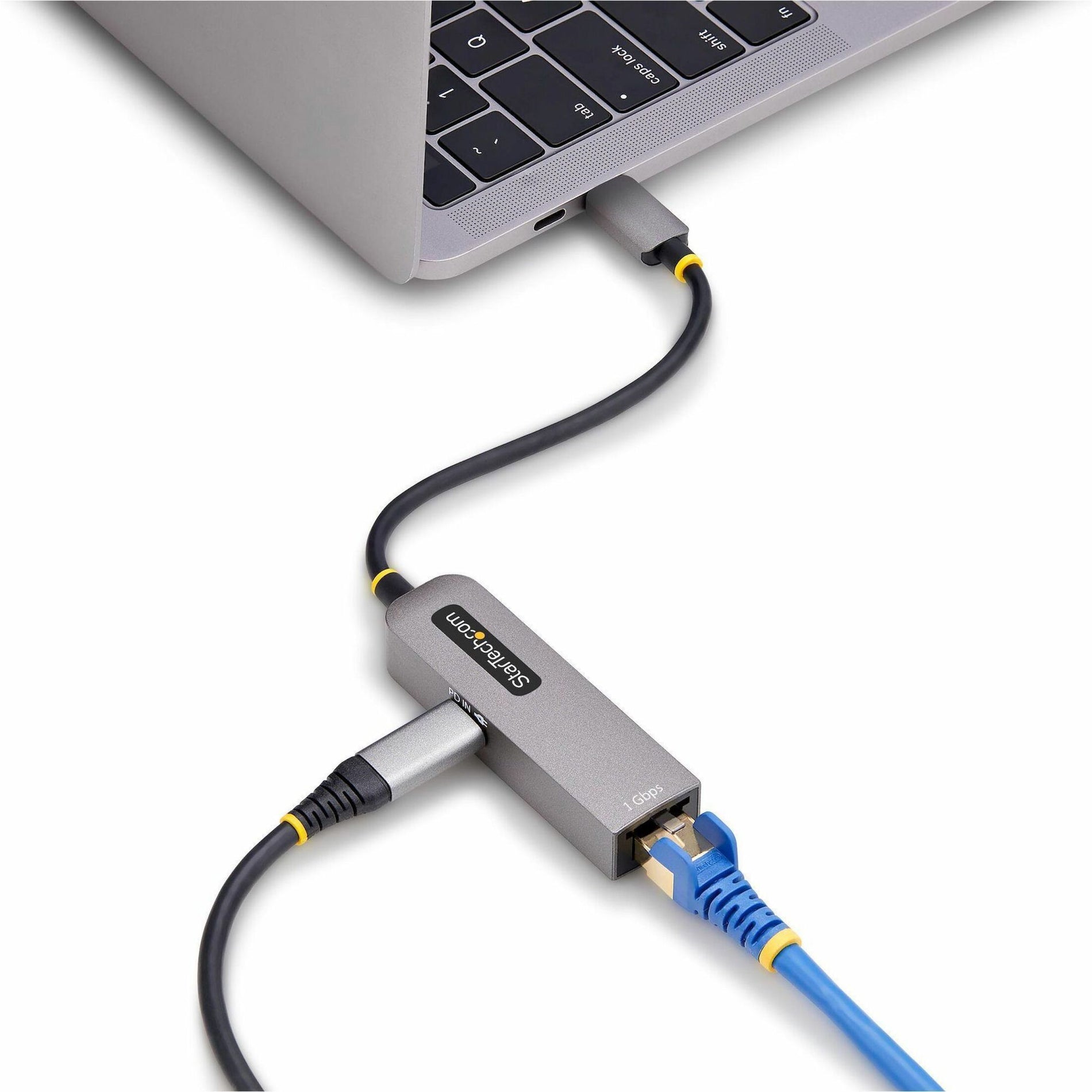 StarTech.com Ethernet adapter connected to laptop showing practical usage-alternate-image6