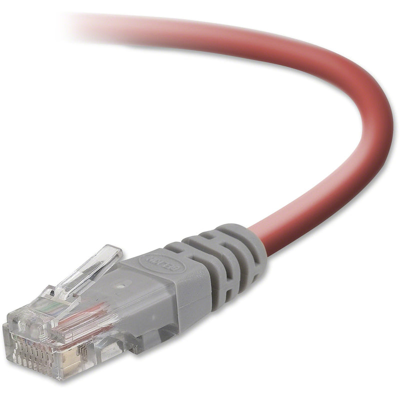 Close-up view of Belkin Cat5e crossover cable RJ45 connector with yellow cable and gray strain relief boot