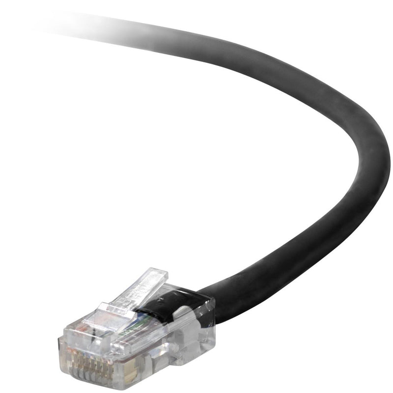 Close-up view of Belkin Cat5e network cable's transparent RJ45 connector with gold-plated pins and black cable jacket