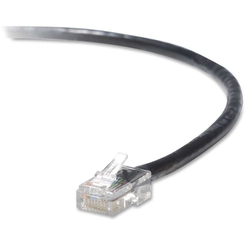 Close-up view of transparent RJ45 connector on black CAT5e network cable showing internal wiring