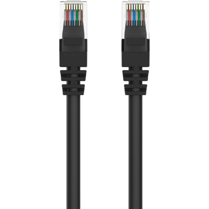 Close-up view of Belkin Cat5e cable RJ45 connectors showing color-coded wiring and transparent housing