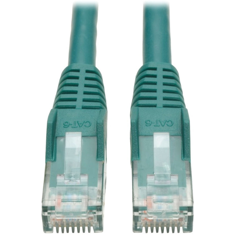 Close-up view of green Cat6 cable RJ-45 connectors showing snagless boots and transparent connector housings