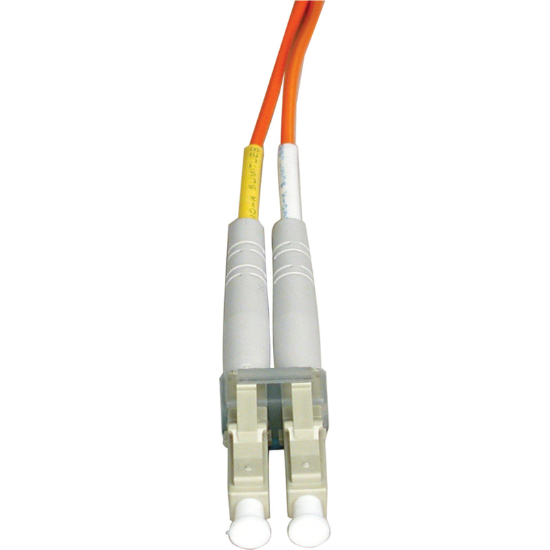 Close-up view of LC connector end of Tripp Lite N516-10M fiber optic cable showing dual-channel design and orange jacket