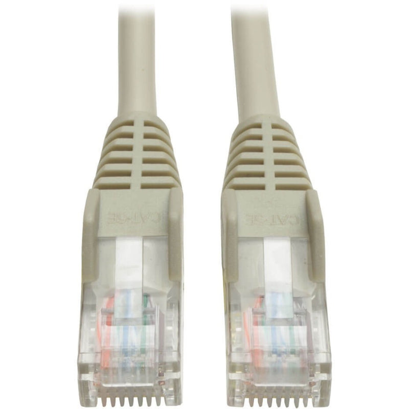 Close-up view of two RJ45 connectors with snagless boots and clear housing showing internal wire arrangement on Tripp Lite Cat5e patch cable