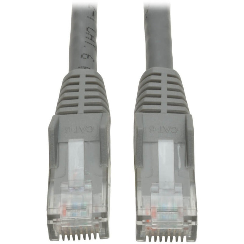 Close-up view of two gray RJ-45 connectors with transparent housing and snagless strain relief boots on Tripp Lite Cat6 patch cable