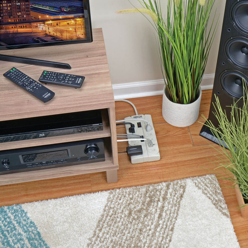 Lifestyle image showing TLP808TEL surge protector used with home entertainment system