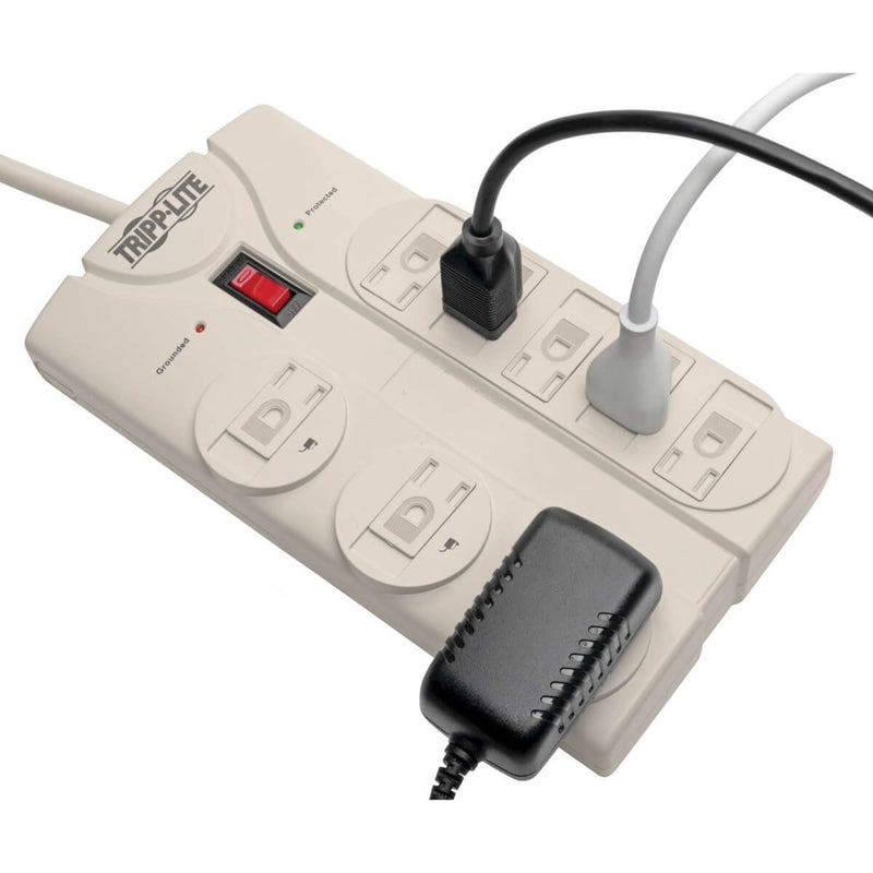 Close-up of surge protector showing transformer-spaced outlets with connected devices