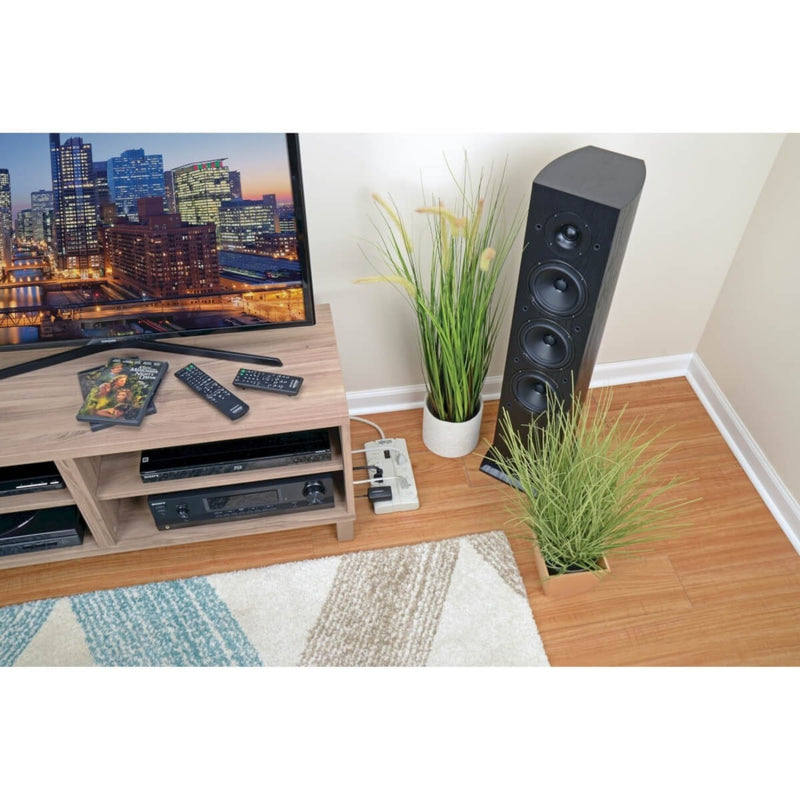 Surge protector shown in home entertainment setting protecting TV and audio equipment