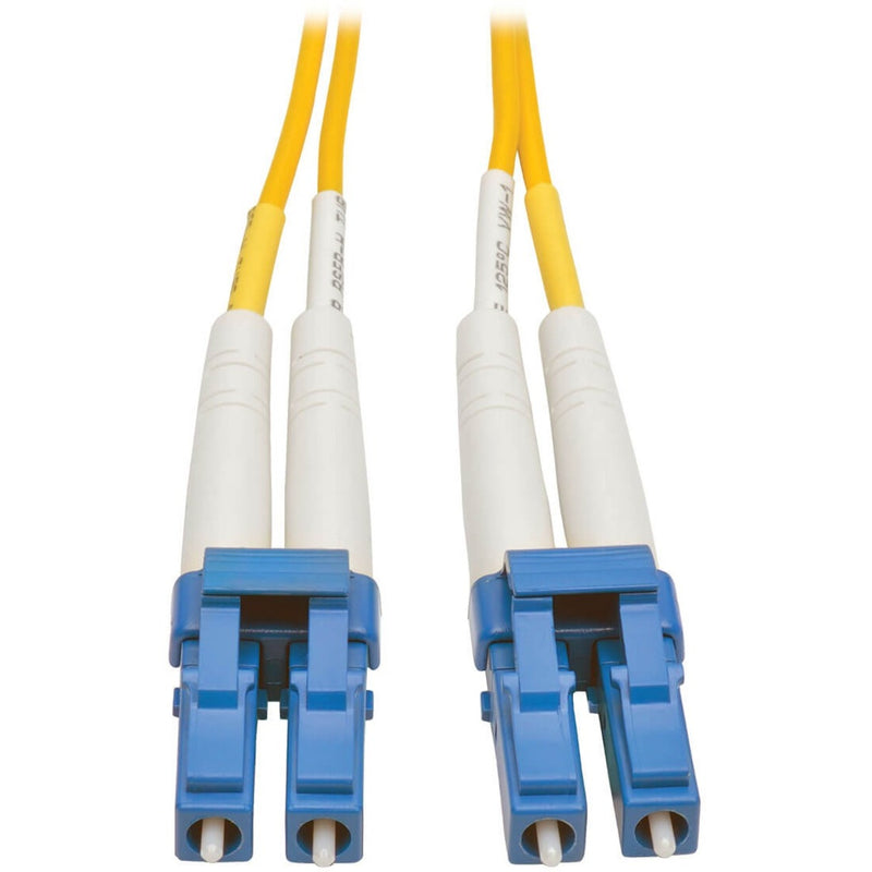 Close-up view of LC connectors on Tripp Lite N370-10M fiber optic cable showing blue connector housing and yellow cable jacket