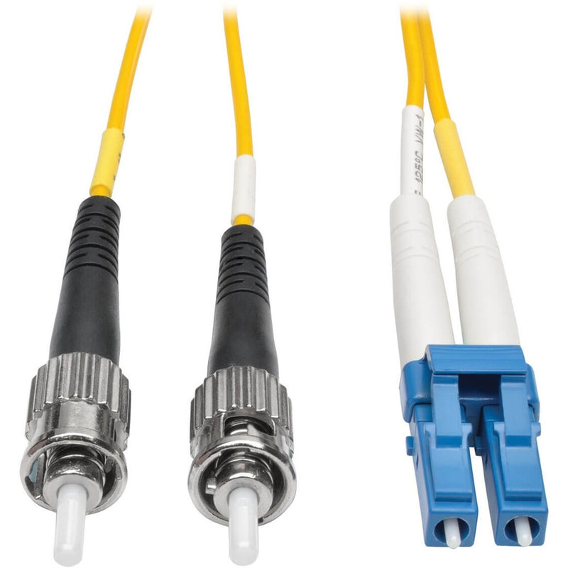 Close-up view of Tripp Lite fiber optic cable connectors showing LC and ST terminations with yellow cable jacket