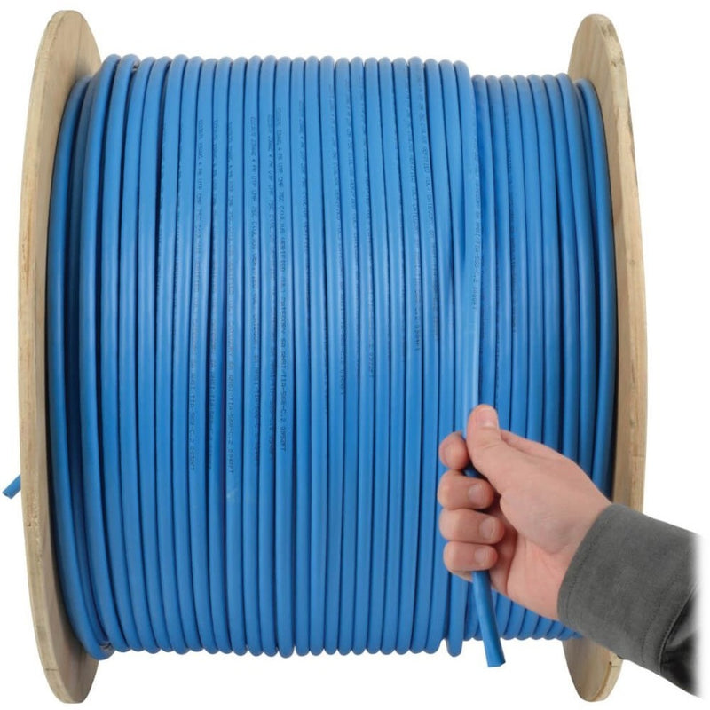 Hand pulling blue Cat5e cable from wooden spool demonstrating ease of use