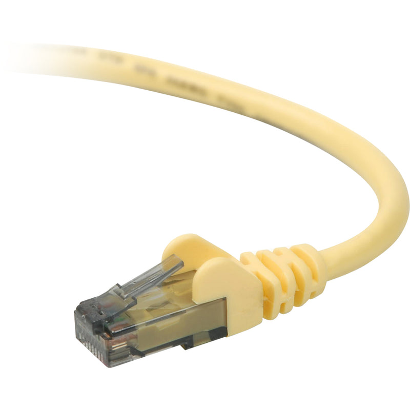 Close-up view of yellow Cat 6 ethernet cable connector showing snagless boot design and RJ-45 termination