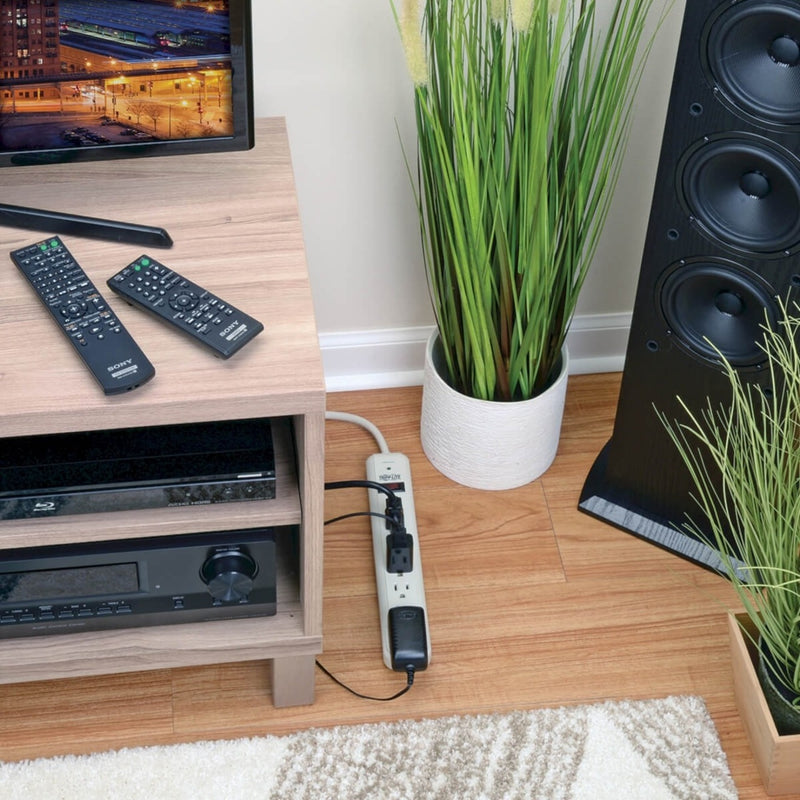 Tripp Lite TLP725 surge protector in home entertainment setting with connected devices