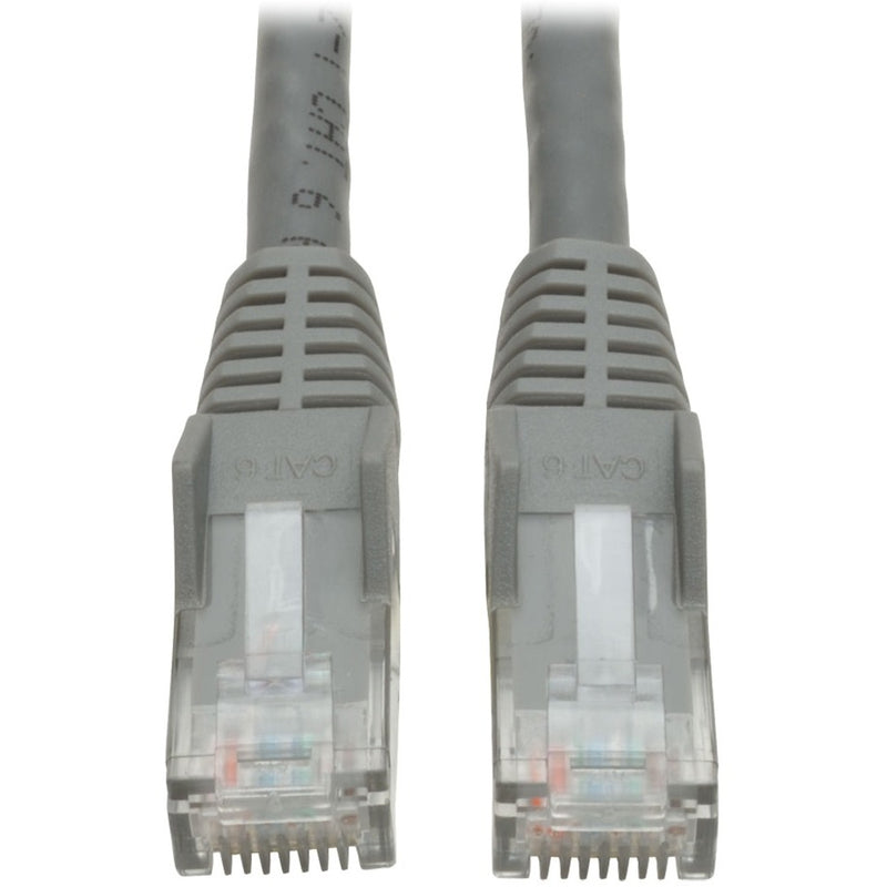 Close-up view of two gray RJ45 connectors with snagless boots and transparent housing showing internal wiring on Tripp Lite Cat6 cable