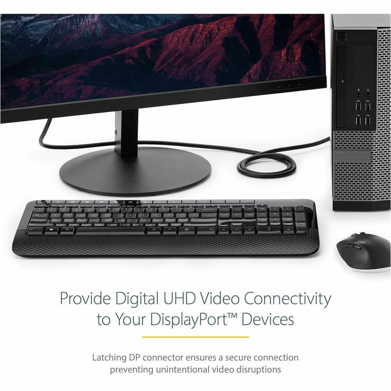 Desktop workstation setup showing DisplayPort cable connected to 4K monitor with keyboard and mouse