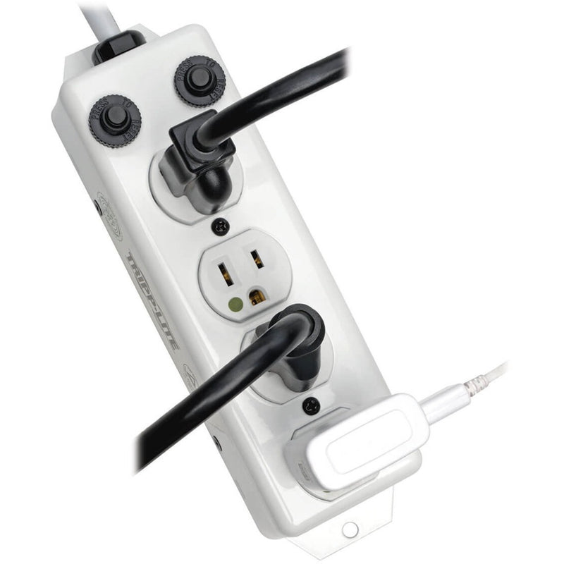 Close-up of power strip showing cord management and safety covers with medical equipment plugs