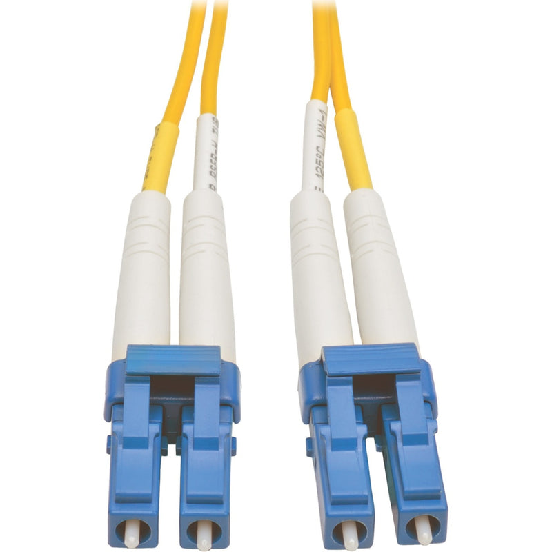 Close-up view of blue LC connectors on yellow singlemode fiber optic patch cable showing duplex design and precision construction