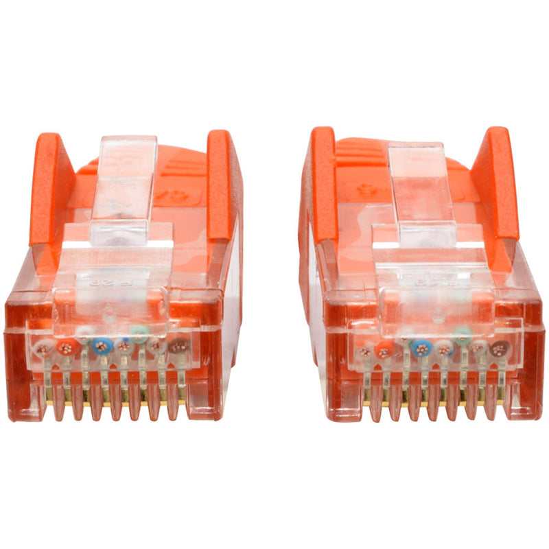 Detailed view of RJ45 connector pins and internal wiring on orange Cat6 cable