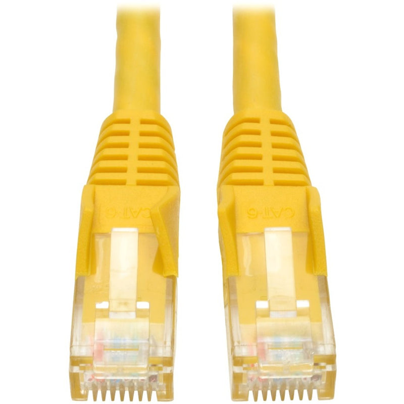 Close-up view of yellow Cat6 cable RJ45 connectors with gold-plated contacts and snagless boots