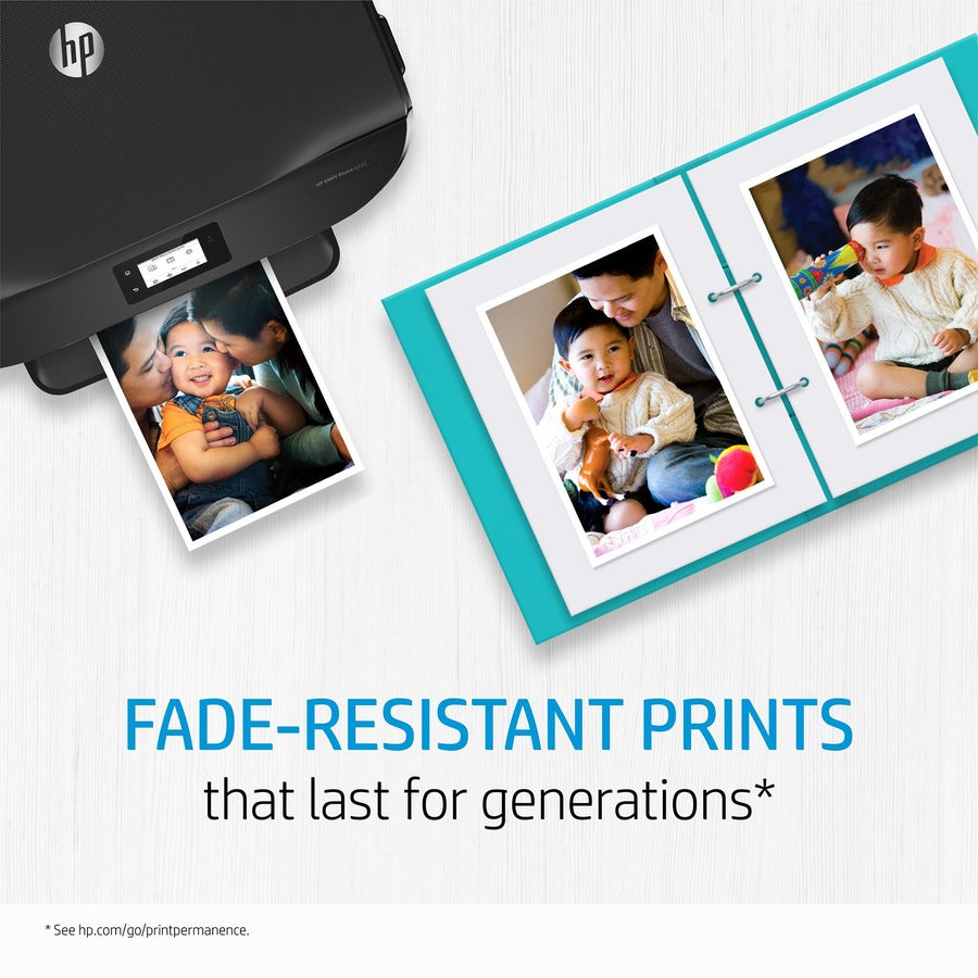 Photo album showing fade-resistant family photos printed with HP ink-alternate-image8