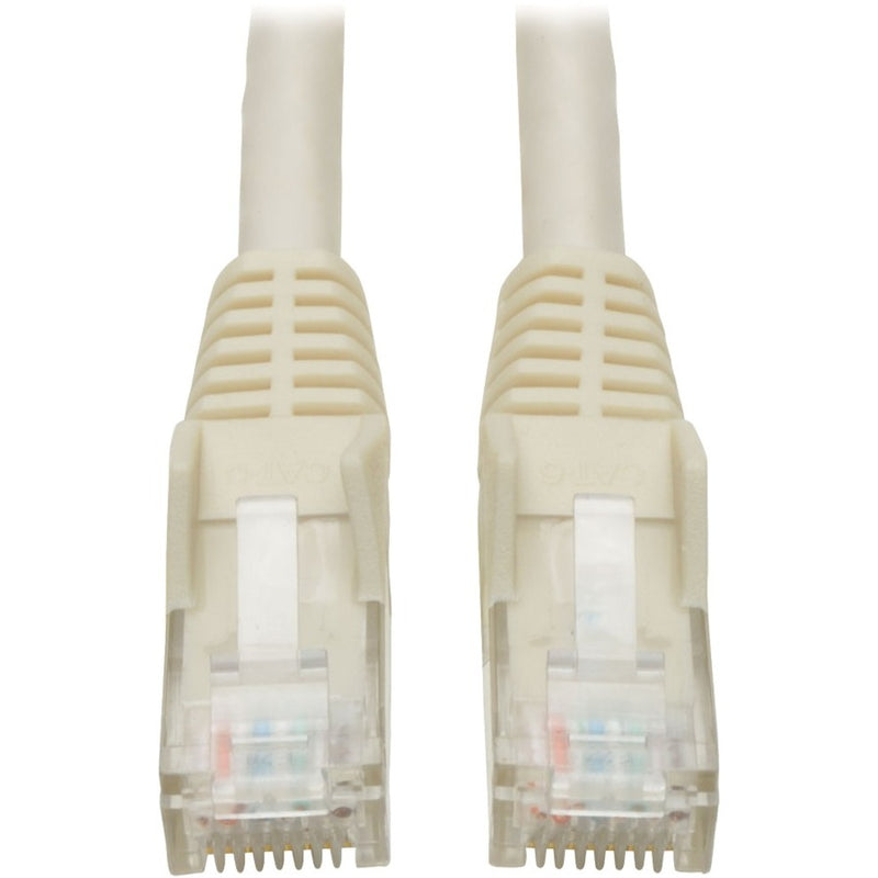 Close-up view of white Cat6 patch cable showing gold-plated RJ-45 connectors with snagless boots and strain relief