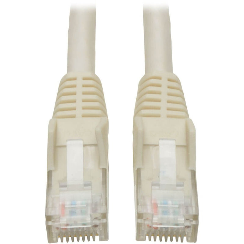 Close-up view of white Cat6 cable RJ-45 connectors with snagless boots and transparent tips showing gold-plated contacts