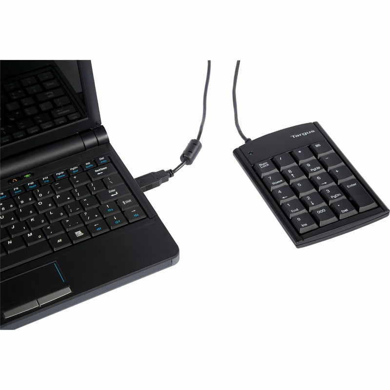 Targus numeric keypad positioned next to laptop keyboard for efficient workflow