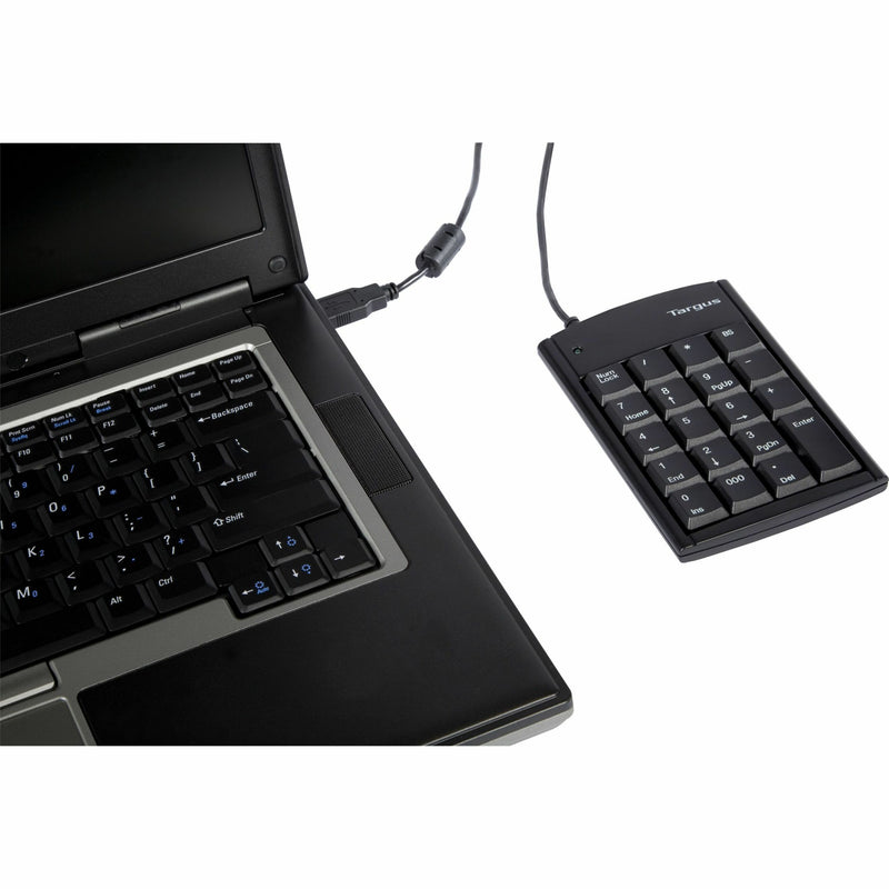 Targus numeric keypad shown in professional work environment with laptop