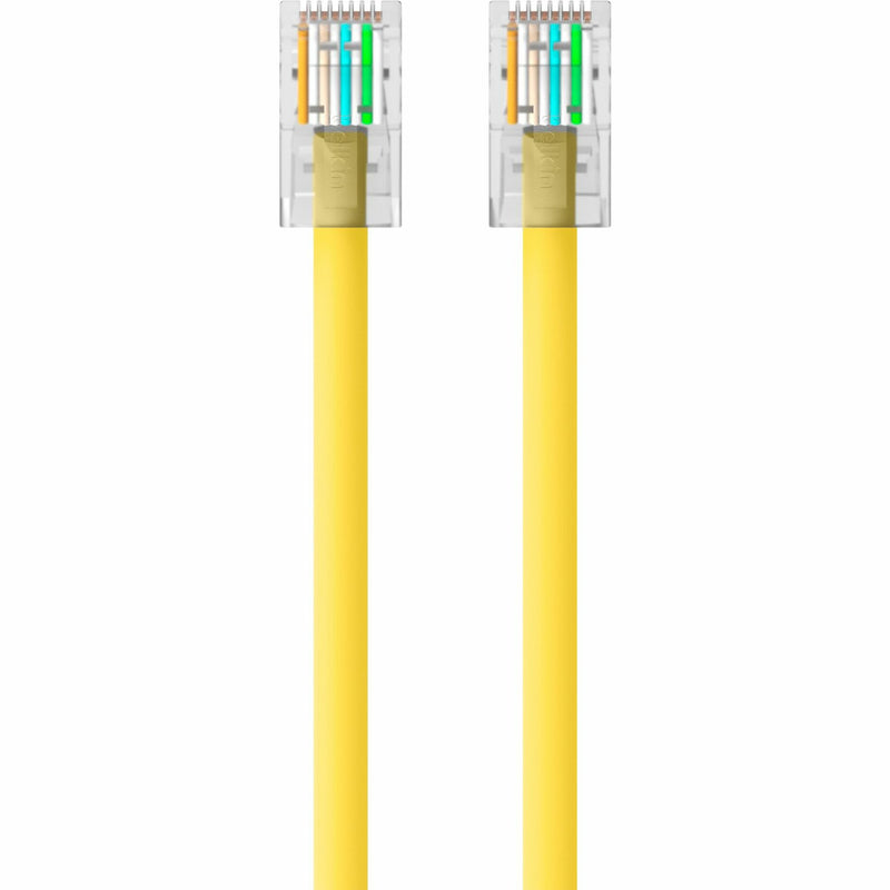 Detailed view of color-coded wire arrangement in RJ45 connector of yellow CAT6 cable