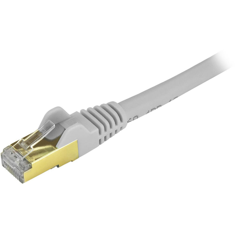 Detailed side view of StarTech.com Cat6a cable connector showing gold contacts and gray strain relief design