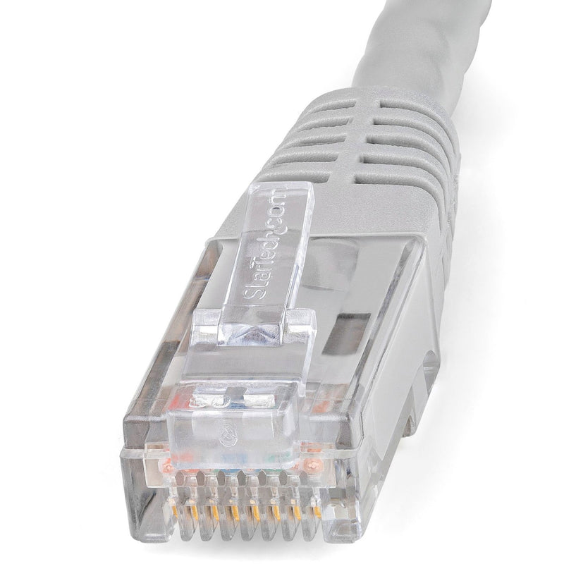 Detailed macro shot of RJ-45 connector showing strain relief boot and internal wiring configuration