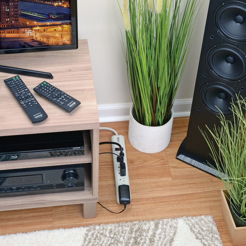 Tripp Lite TLP74R installed in entertainment center protecting audio-visual equipment