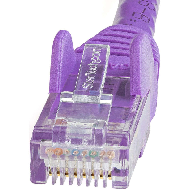 Macro shot of purple Cat6 connector showing StarTech branding and internal gold-plated pins