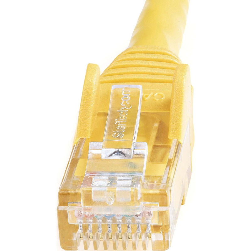 Detailed macro shot of StarTech.com branded RJ45 connector showing internal wiring and pin structure