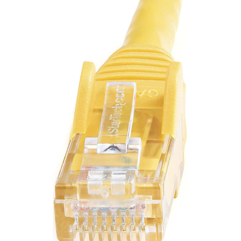 Detailed macro shot of StarTech.com branded RJ45 connector showing internal pin structure