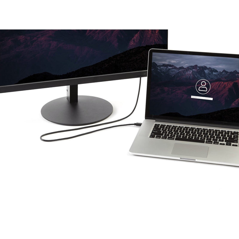 MacBook connected to external monitor using Mini DisplayPort to DisplayPort cable in modern workspace setup