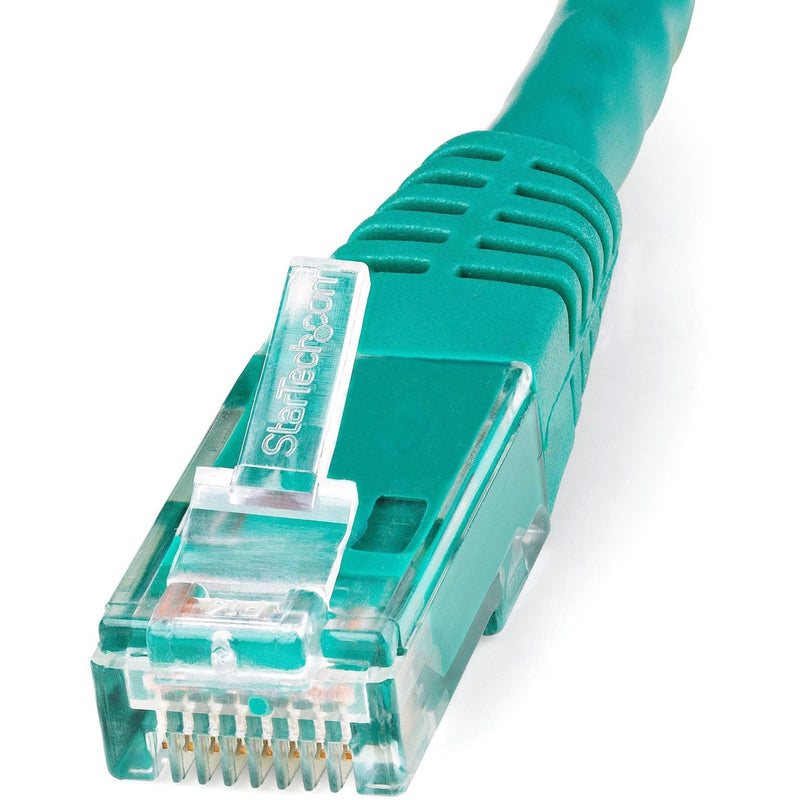 Macro shot of green Cat6 ethernet cable connector showing gold-plated pins and StarTech branding