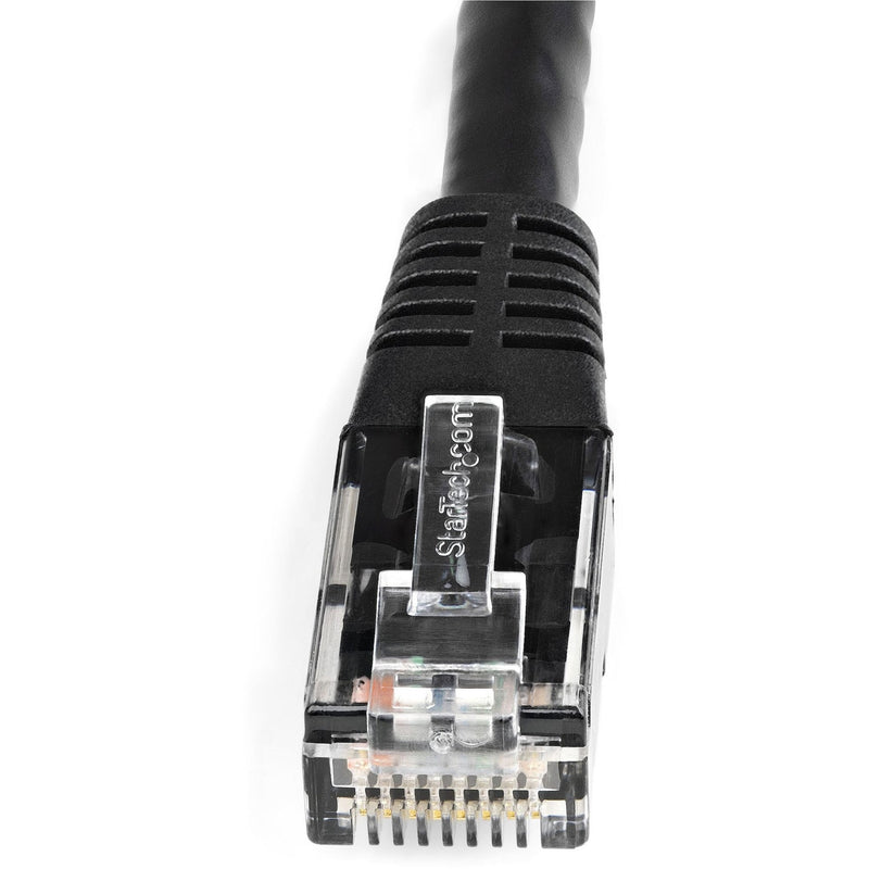 Detailed view of StarTech.com Cat6 cable's black strain relief boot with molded channels for bend protection