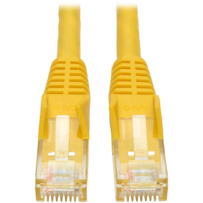 Close-up view of yellow Cat6 ethernet cable ends showing gold-plated RJ-45 connectors with transparent housing and snagless boots