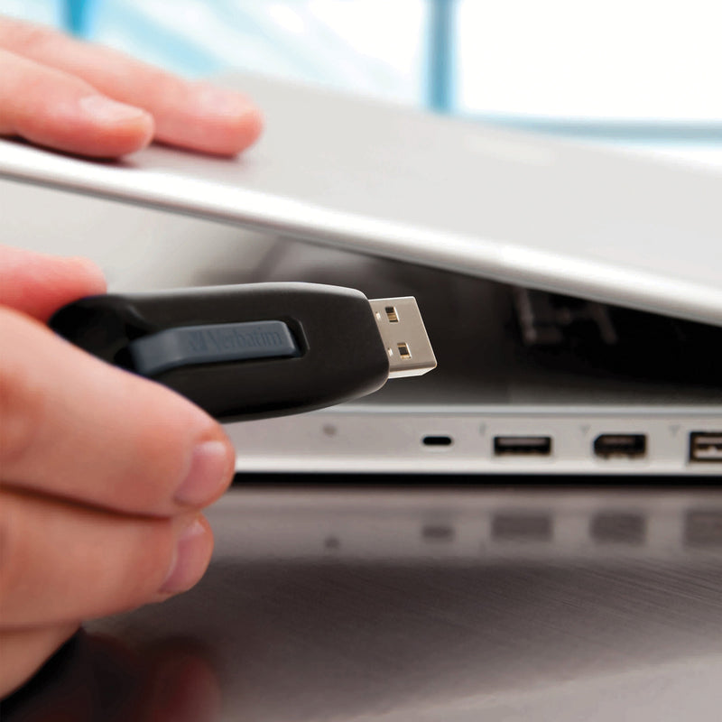 USB drive being inserted into laptop port showing ease of use