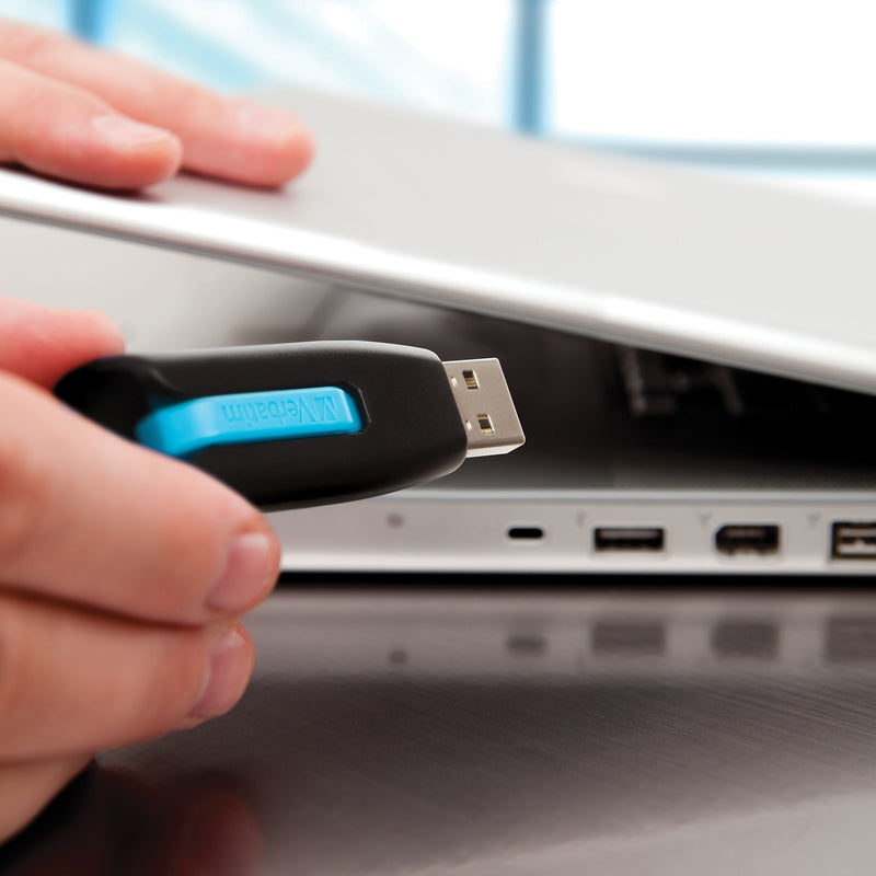 Store 'n' Go V3 USB drive being inserted into a laptop USB port