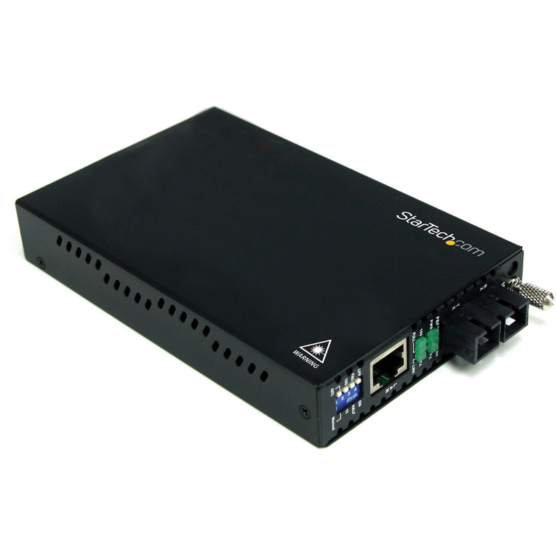 StarTech.com ET90110SM302 fiber media converter top angled view showing black metal housing and connection ports