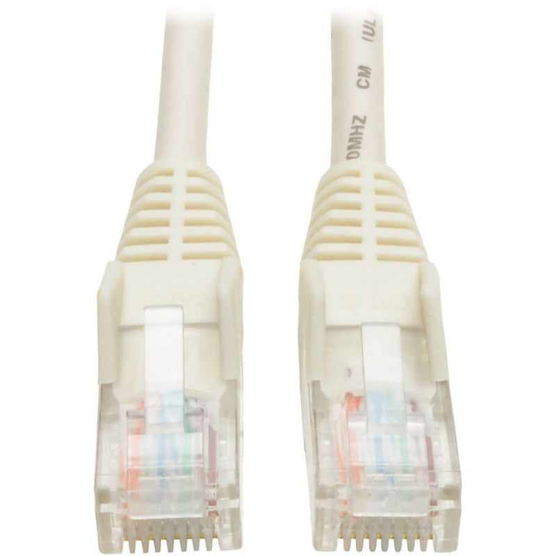 Close-up view of white Cat5e cable ends showing snagless RJ45 connectors with transparent housing and internal wiring configuration