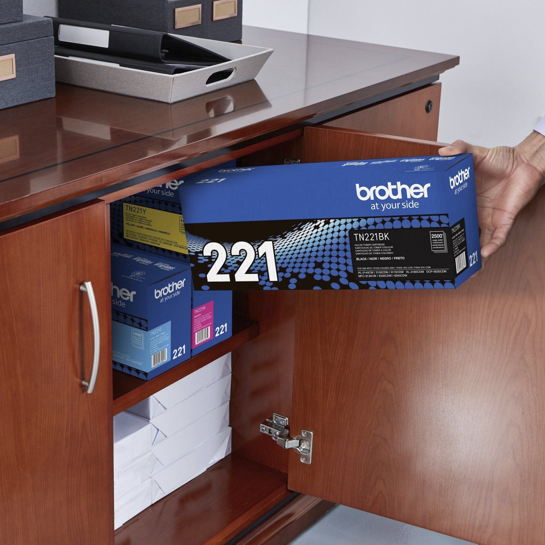 Brother TN221BK toner cartridge being stored in office cabinet-alternate-image5