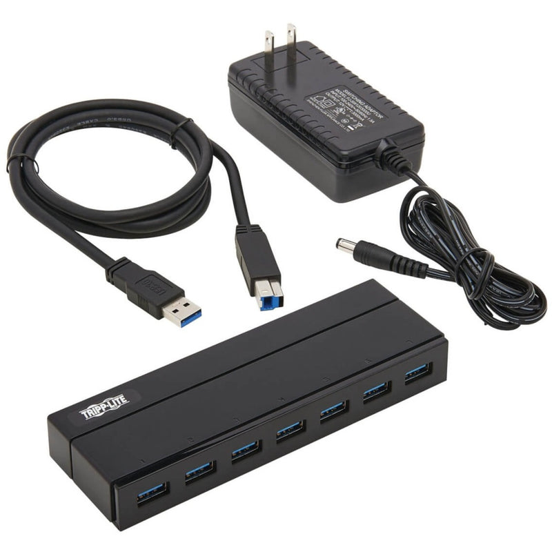 Complete package contents of Tripp Lite USB hub including cables and power adapter