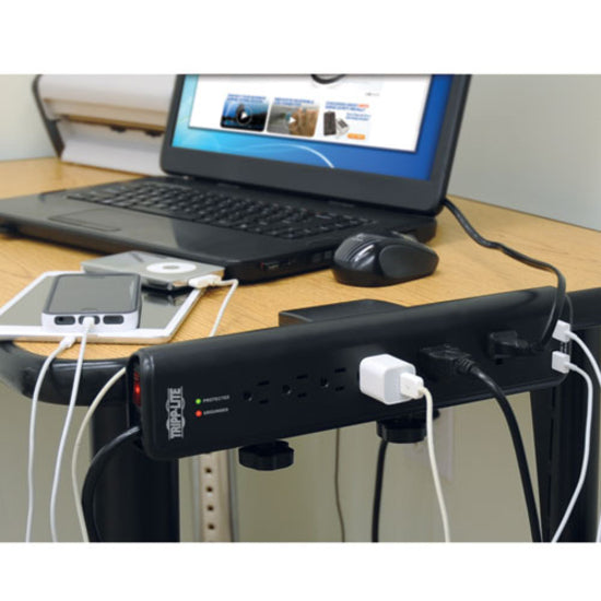 Tripp Lite surge protector in use at a computer workstation with multiple devices connected