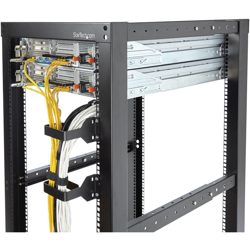 Close-up of server rack showing D-ring hooks organizing multiple cable bundles