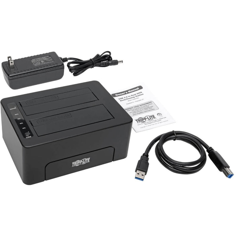 Complete package contents of Tripp Lite docking station including power adapter, USB cable, and documentation