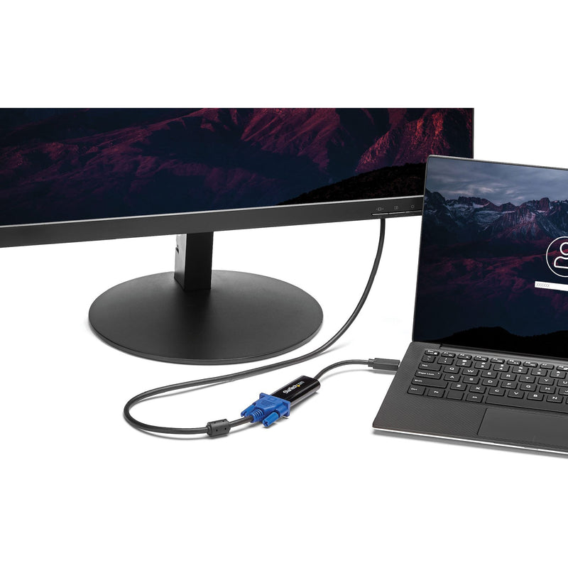 StarTech.com adapter connecting laptop to external monitor in workspace setting