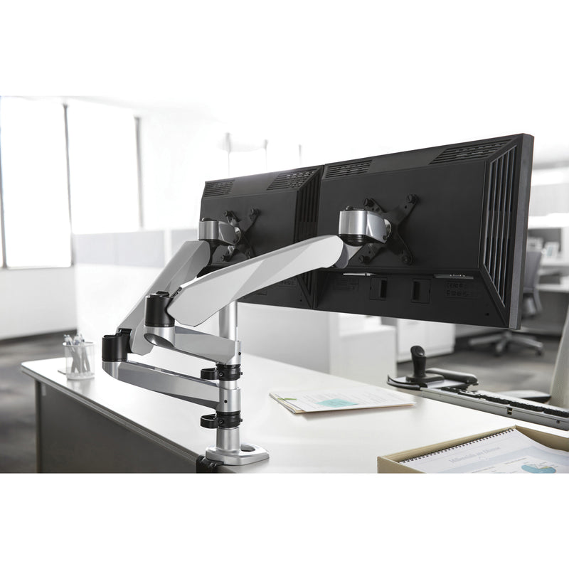 Modern office setup with dual monitors mounted on 3M arm showing clean workspace organization